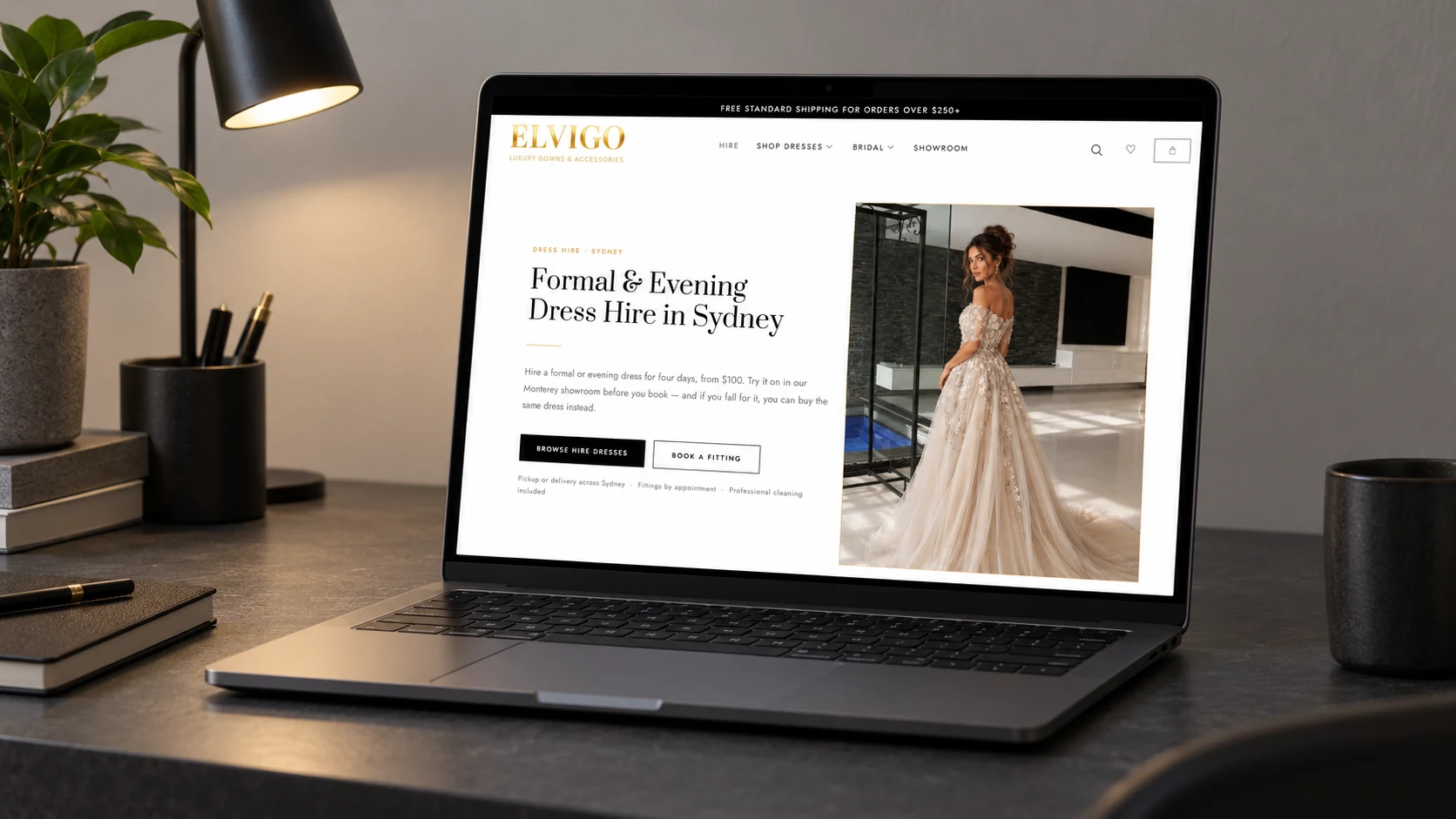 The Elvigo Fashion dress hire page on a laptop, showing the hire heading, the four day price and the fitting call to action